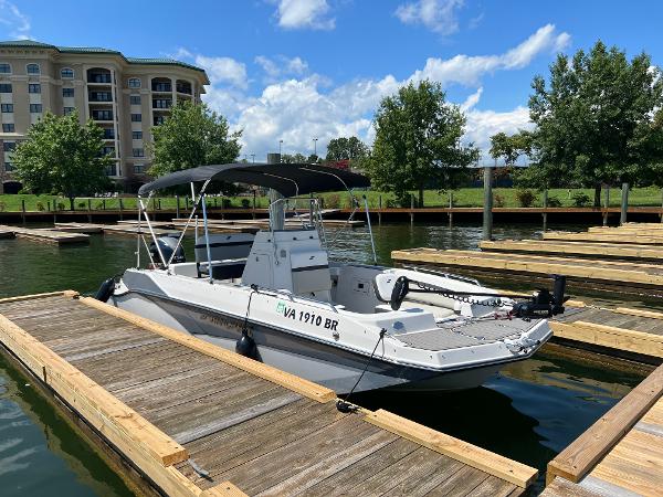 Starcraft SVX 211 OB CC 2024 Starcraft SVX 211 OB CC boat docked on a sunny day.