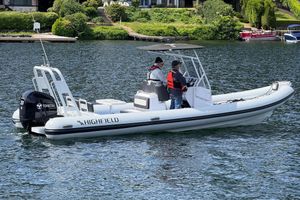 Highfield Sport 760 2023 Highfield Sport 760 boat on water with two people onboard.