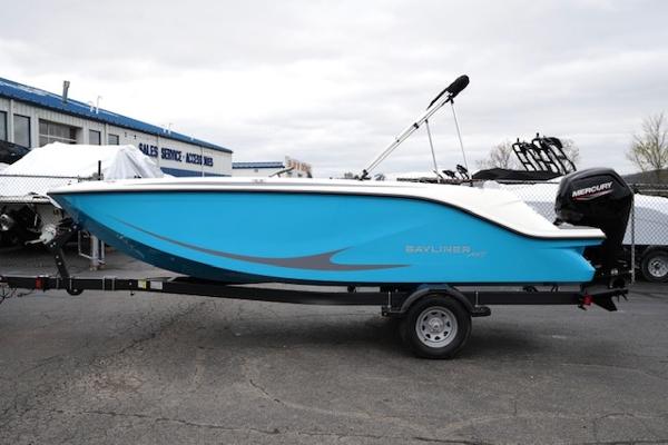 Bayliner Element M19 2025 Bayliner Element M19 boat on trailer, blue hull, parked outdoors.