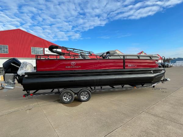 Regency 250 DL3 2024 Regency 250 DL3 pontoon boat on a trailer, red and black exterior.