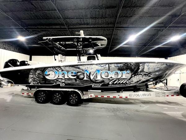 Fountain 34 TE 2022 Fountain 34 TE boat One Moon Time on a trailer in a warehouse.