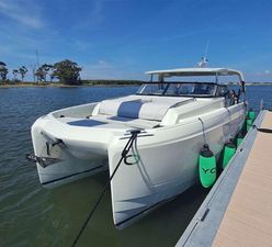 YOT 36 Modern YOT 36 catamaran docked, 2025 model, sleek design, sunny day, calm waters.