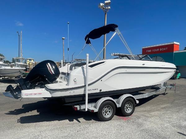 Bayliner DX 2200 2021 Bayliner DX 2200 boat on a trailer with a Mercury outboard motor.