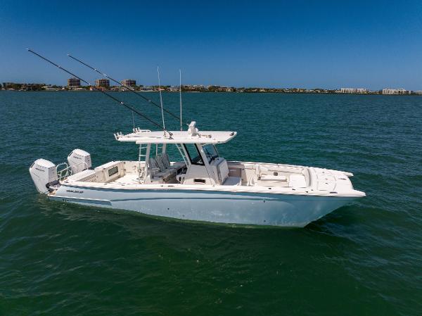 World Cat 400 CC-X 2022 World Cat 400 CC-X boat on open water with fishing rods.