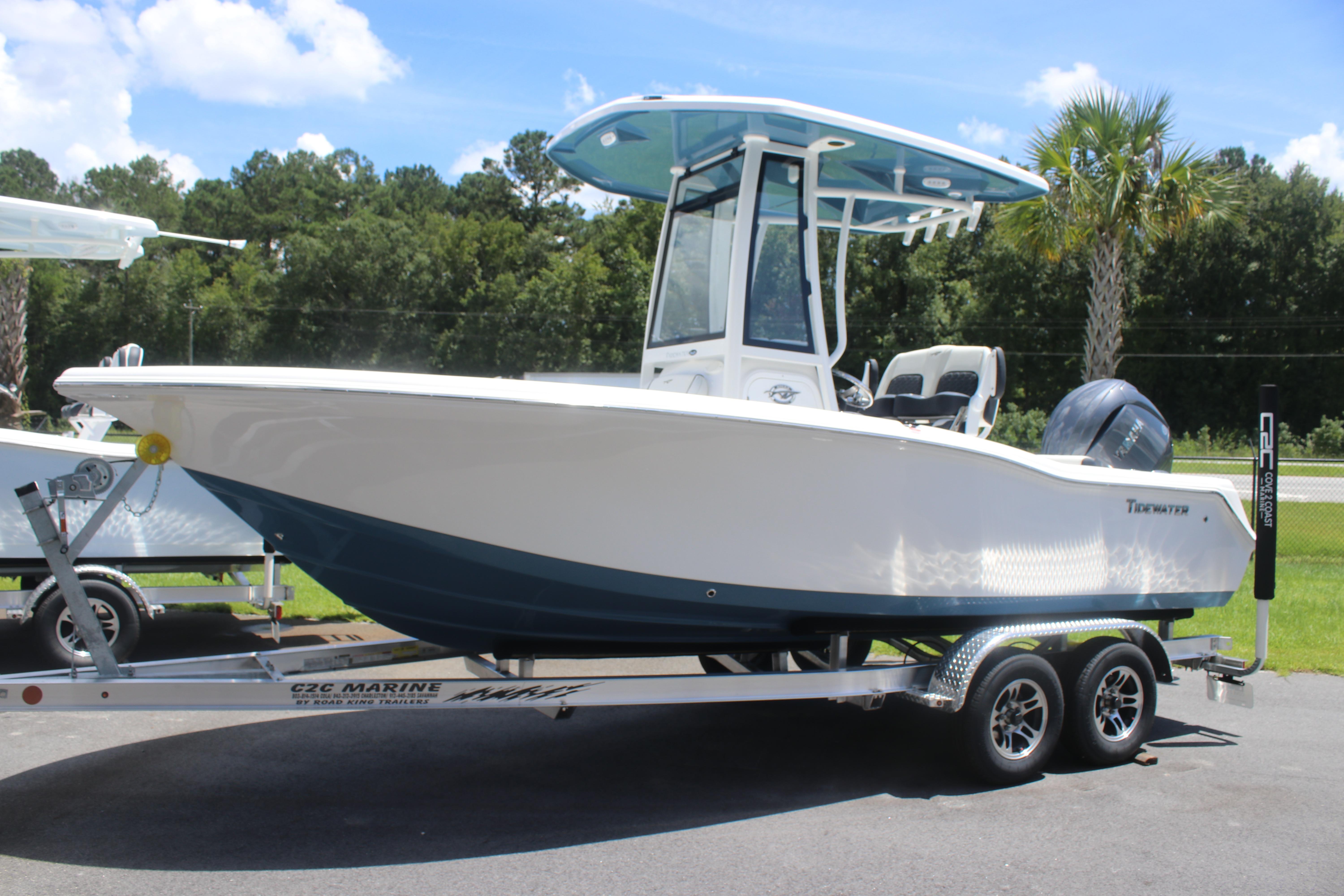 Tidewater 210 CC Adventure 2026 Tidewater 210 CC Adventure boat on trailer, parked outdoors under blue sky.