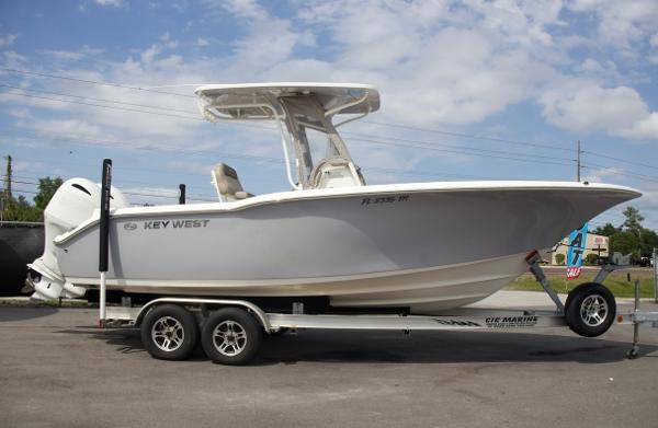Key West 244 Center Console 2023 Key West 244 Center Console boat on a trailer under a blue sky.