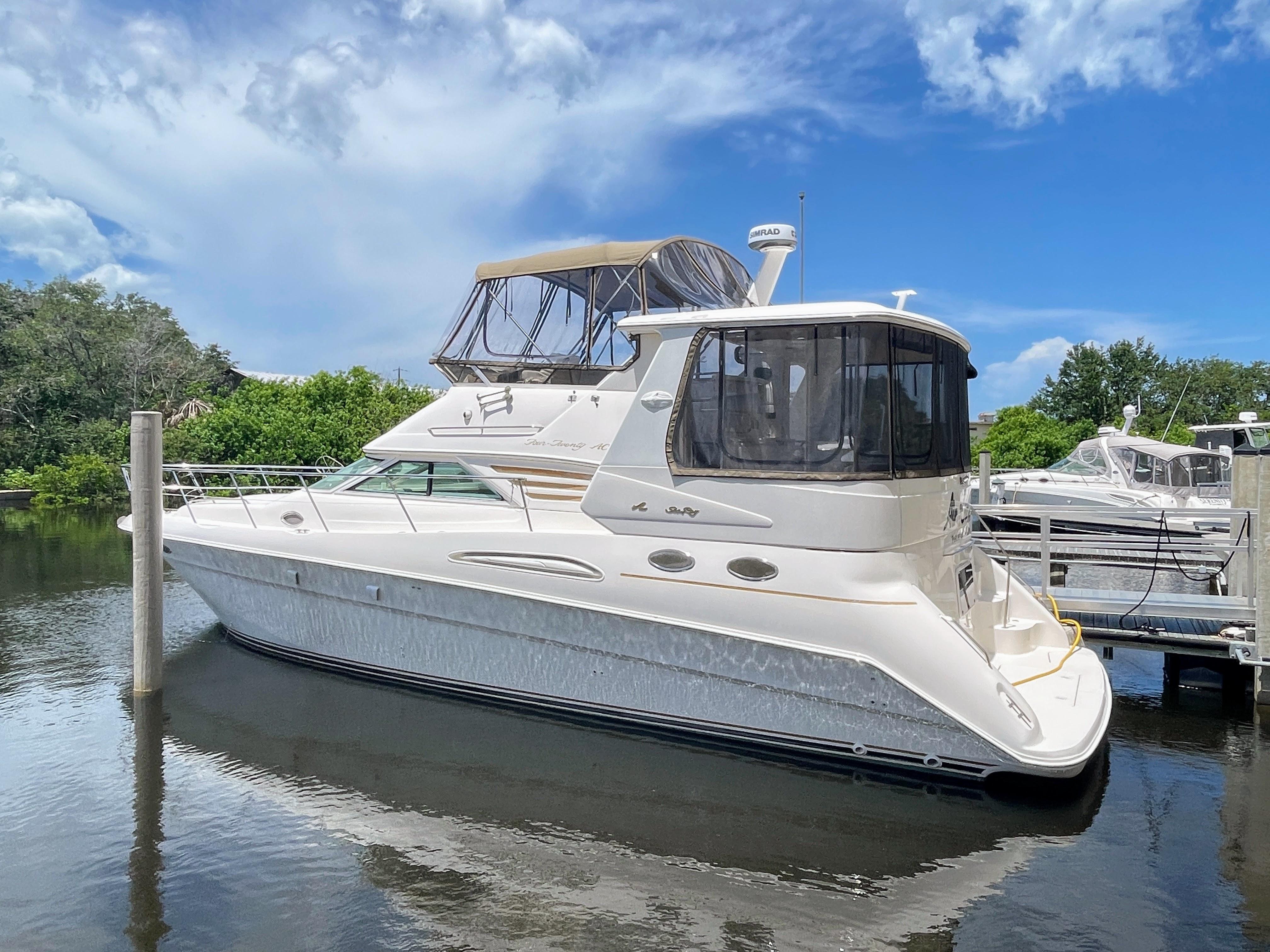 Sea Ray 420 Aft Cabin 1998 Sea Ray 420 Aft Cabin yacht docked in a marina on a sunny day.
