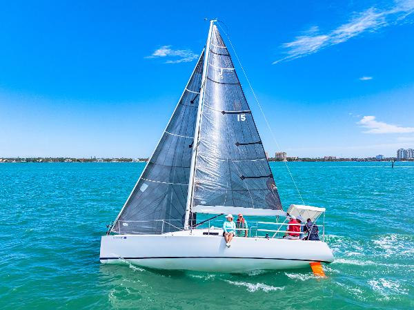J Boats J/95 2011 J Boats J/95 sailing on clear blue waters under a sunny sky.