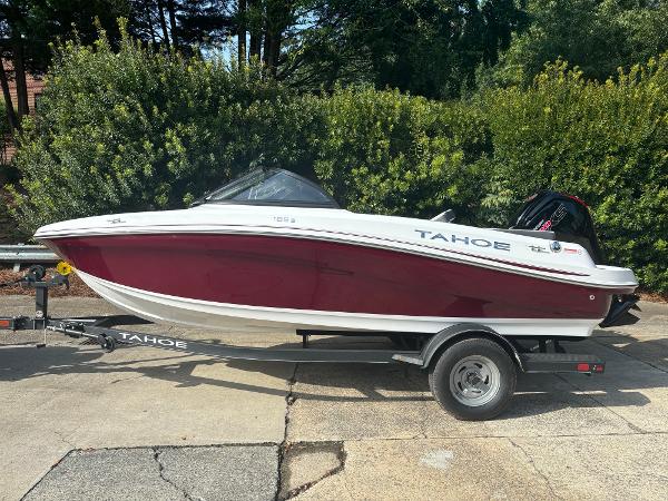 Tahoe 185 S 2024 Tahoe 185 S boat on trailer, red and white design, parked outdoors.