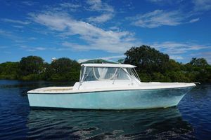 Custom Michael Fritz 34' Pilothouse Custom Michael Fritz 34' Pilothouse boat, 2005 model, on calm water with blue sky.