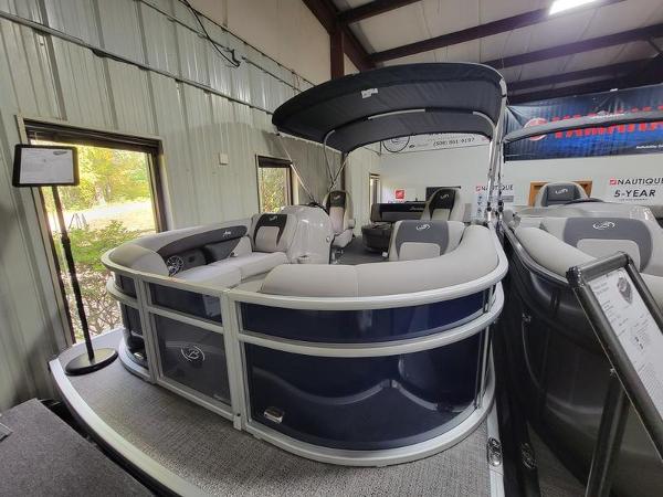 Barletta A20UC 2025 Barletta A20UC pontoon boat displayed indoors with seating and canopy.