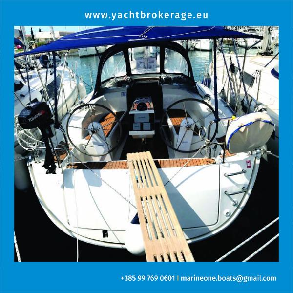 Bavaria Cruiser 34 Bavaria Cruiser 34 yacht, 2017 model, docked with blue canopy and twin steering wheels.
