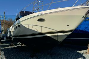 Regal Commodore 3860 2002 Regal Commodore 3860 yacht on stands, side view, under clear blue sky.