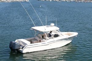 Grady-White Freedom 307 2017 Grady-White Freedom 307 boat on calm water, featuring dual engines.