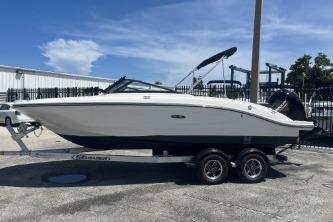 Sea Ray SPX 210 Outboard 2022 Sea Ray SPX 210 Outboard boat on trailer, parked outdoors under blue sky.