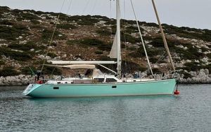 Hylas 54 Sailing yacht Hylas 54, 1999 model, anchored in serene coastal waters.