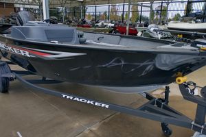 Tracker Pro Guide V-16 SC 2026 Tracker Pro Guide V-16 SC boat on trailer, displayed outdoors.