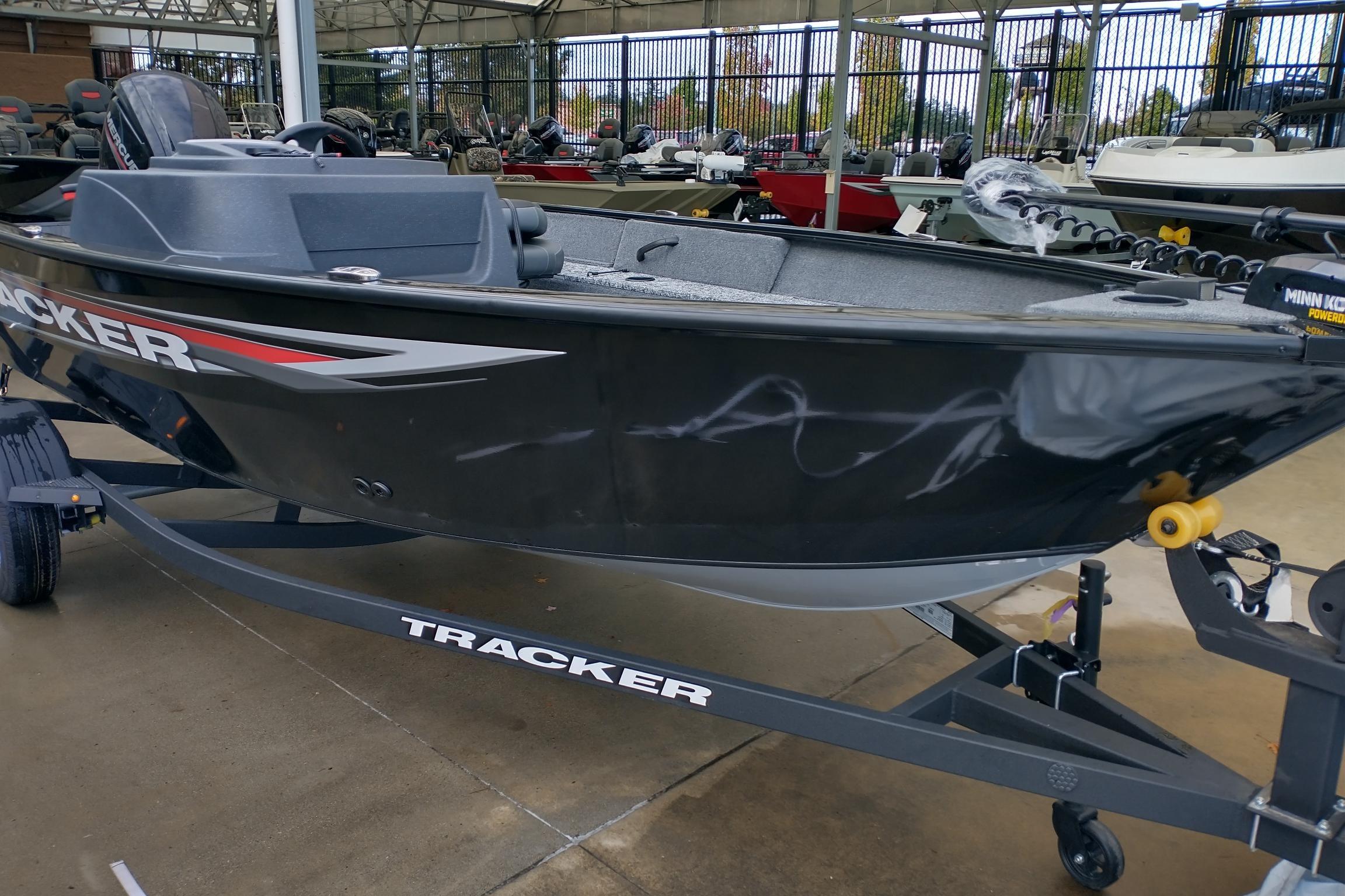 Tracker Pro Guide V-16 SC 2026 Tracker Pro Guide V-16 SC boat on trailer, displayed outdoors.
