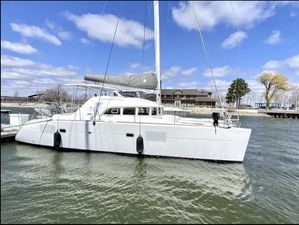 Lagoon 380 S2 2018 Lagoon 380 S2 catamaran docked on a sunny day with blue skies.
