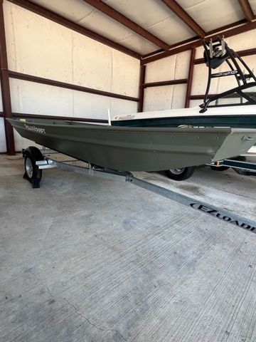 Polar Kraft DKJ1436 2023 Polar Kraft DKJ1436 boat on trailer in a storage facility.