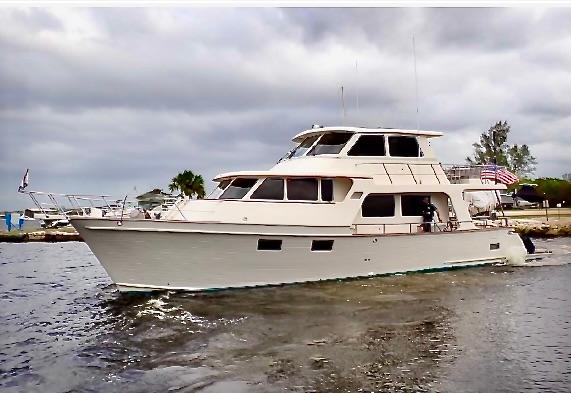 Marlow 53E CB 2018 Marlow 53E CB yacht cruising on a cloudy day near the shore.