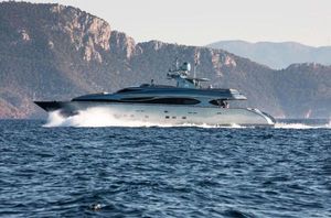 Maiora 33 DP Luxury Maiora 33 DP yacht cruising on the sea, 2006 model, with scenic mountain backdrop.