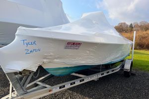 Parker 1801 Center Console 2018 Parker 1801 Center Console boat covered, on trailer, with "For Sale" sign.