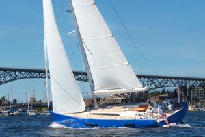 Solaris 50 2023 Solaris 50 sailboat cruising near a bridge on a sunny day.