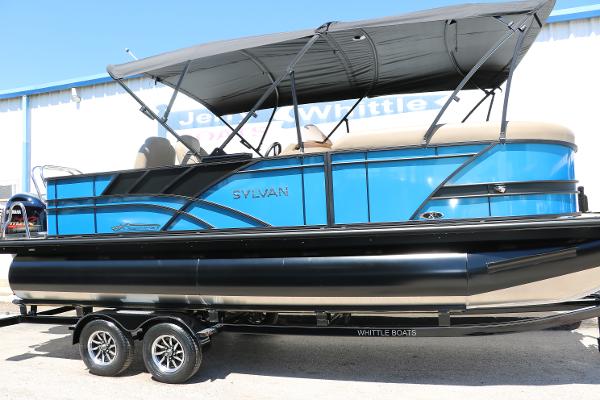 Sylvan Mirage X3 Party Fish 2025 Sylvan Mirage X3 Party Fish pontoon boat on trailer.