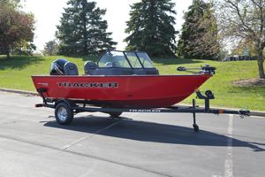 Tracker Pro Guide V-16 WT 2026 Tracker Pro Guide V-16 WT boat on trailer, parked outdoors.