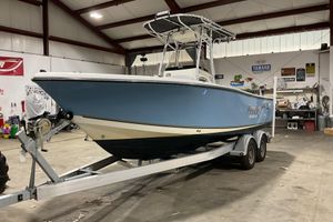 Mako 214 Center Console 2022 Mako 214 Center Console boat on trailer in a garage setting.
