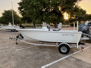 Sportsman Island Reef 17 Center Console 2016 Sportsman Island Reef 17 Center Console boat on trailer in parking lot at sunset.