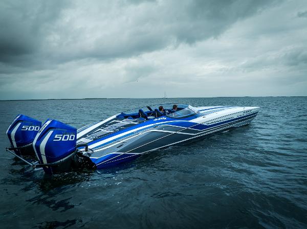 MTI 440X 2024 MTI 440X speedboat with dual 500 engines on open water under cloudy skies.