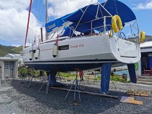 Jeanneau Sun Odyssey 410 2020 Jeanneau Sun Odyssey 410 sailboat on stands, with blue canopy and visible Sunsail branding.