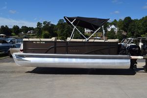 Crest Classic LX 220 L 2024 Crest Classic LX 220 L pontoon boat with canopy, parked on a sunny day.