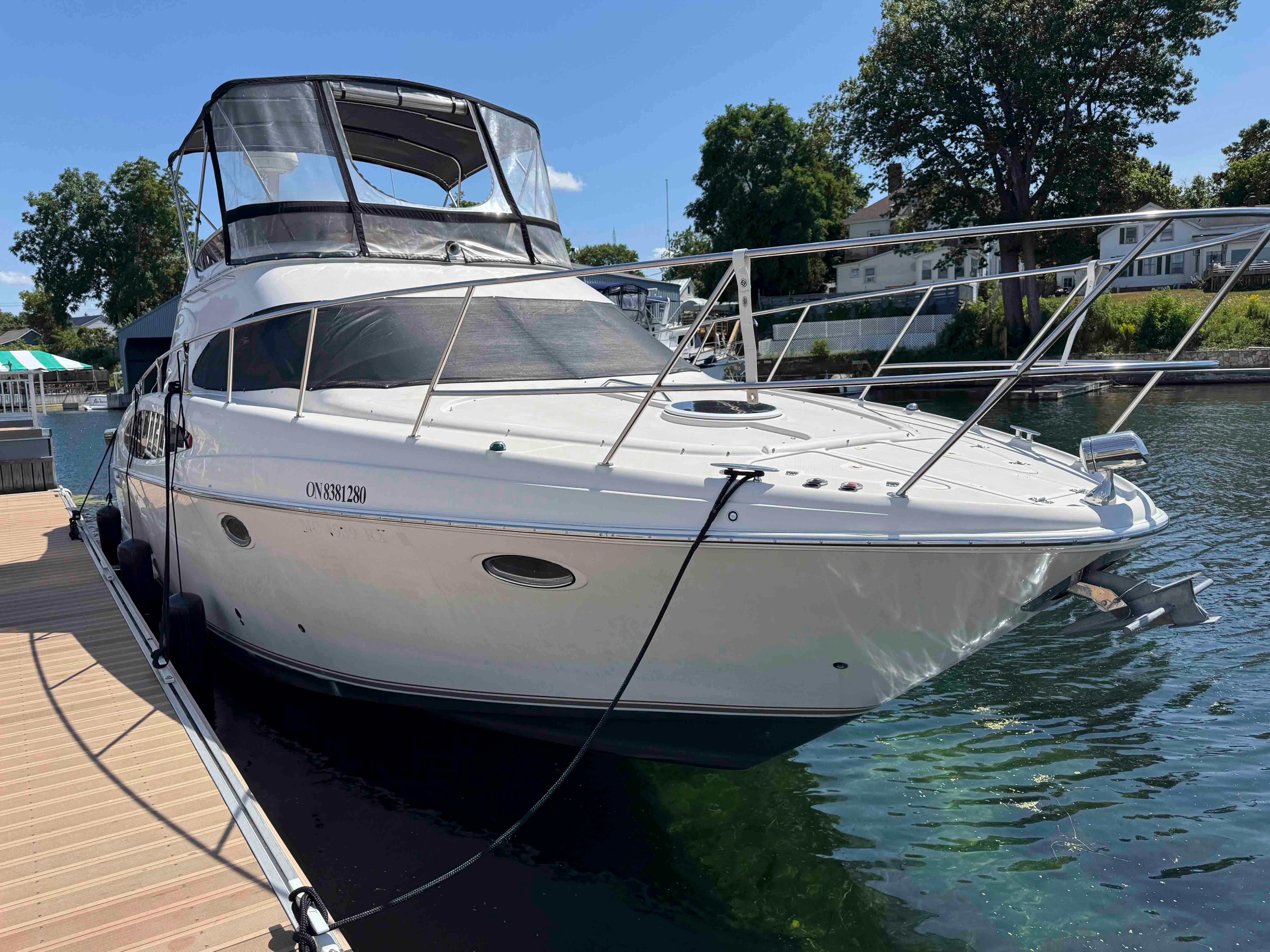 Regal Commodore 3780 2001 Regal Commodore 3780 yacht docked at a marina, sunny day, clear water.