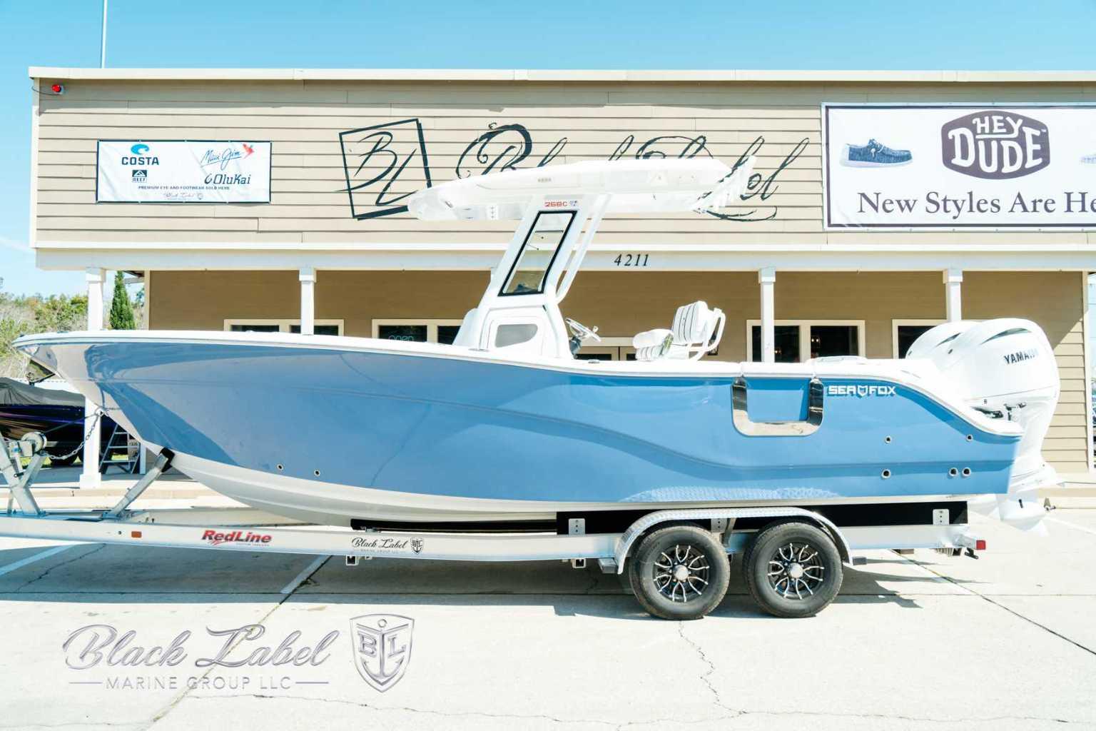 Sea Fox 268 Commander 2025 Sea Fox 268 Commander boat on trailer, displayed outside a building.