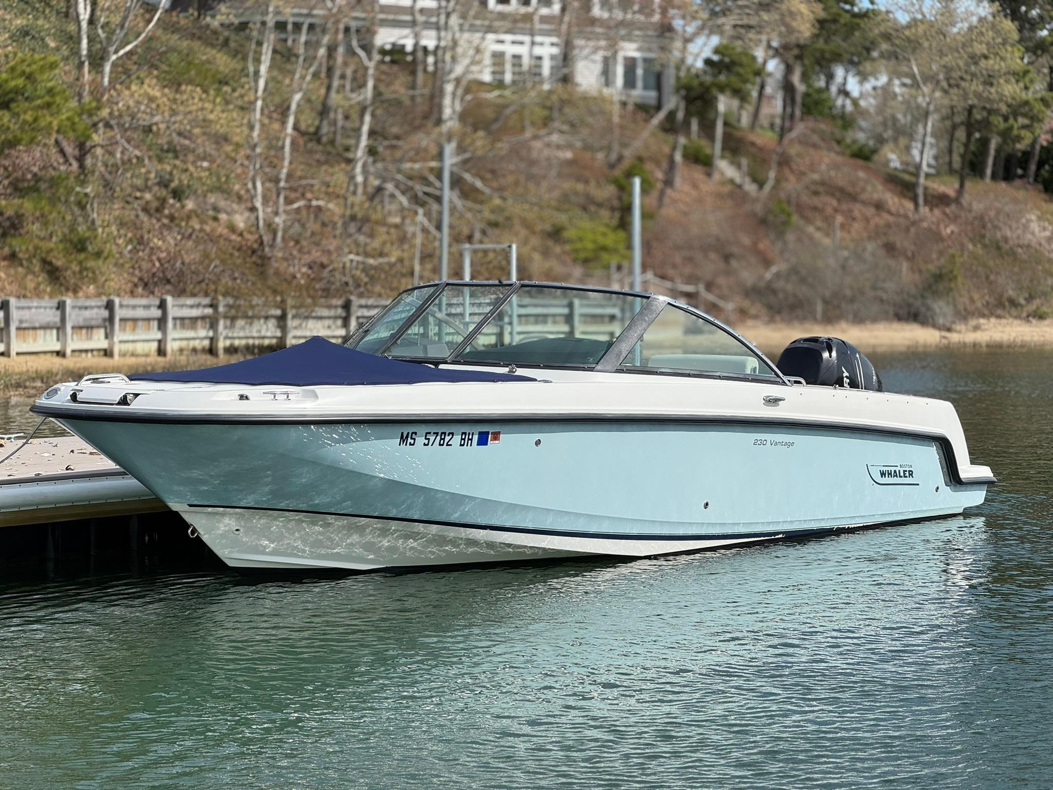 Boston Whaler 230 Vantage 2016 Boston Whaler 230 Vantage boat docked on calm water.