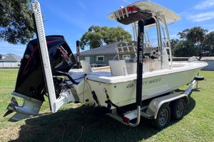 Key West 230 Bay Reef 2020 Key West 230 Bay Reef boat on trailer, featuring powerful outboard motor.
