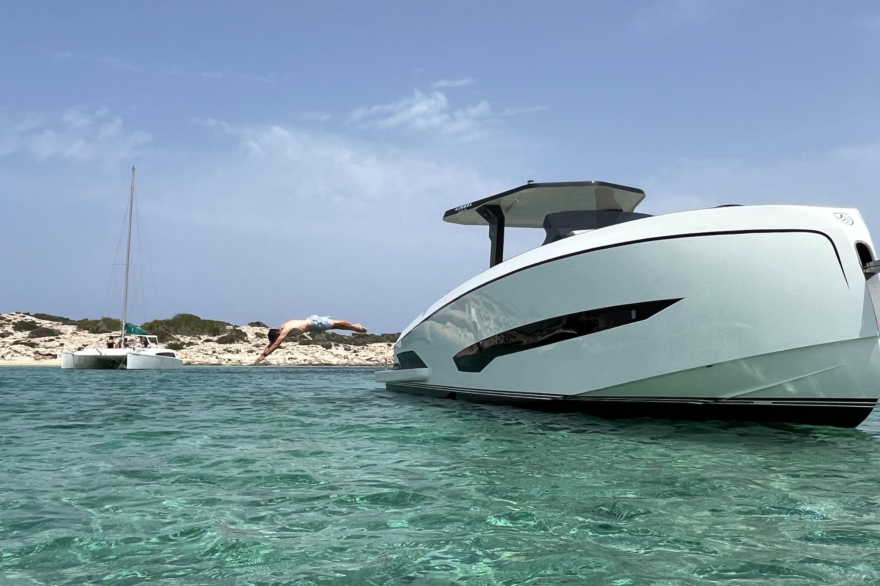 Kumbra 34 Modern Kumbra 34 yacht in clear waters, person diving nearby, 2026 model.