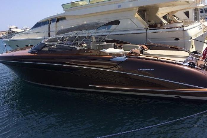 Riva RivaRama 44 2005 Riva RivaRama 44 luxury yacht docked in marina, sleek design, elegant finish.