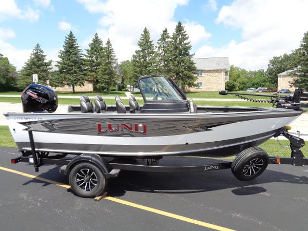 Lund 1775 Impact XS 2024 Lund 1775 Impact XS fishing boat on trailer.