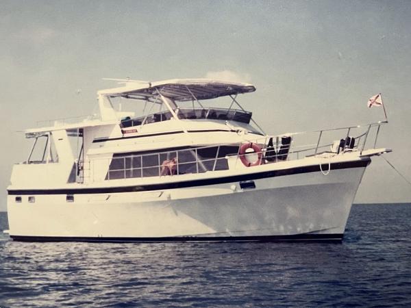 Seamaster 48 Motor Yacht 1987 Seamaster 48 Motor Yacht cruising on open water, featuring a classic design.