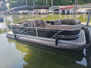 Sylvan Mirage 822 LZ 2025 Sylvan Mirage 822 LZ pontoon boat docked on calm water.
