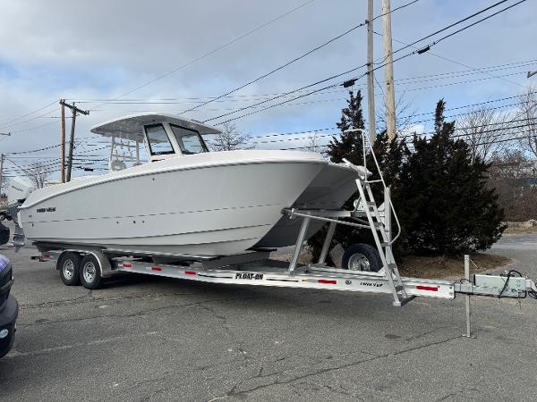Twin Vee 280 GFX2 CC 2025 Twin Vee 280 GFX2 CC boat on trailer, parked outdoors.