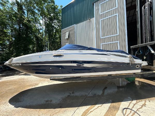 Sea Ray 260 Sundeck 2010 Sea Ray 260 Sundeck boat in dry dock, side view.