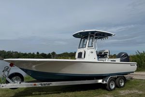 Tidewater 2410 Bay Max 2026 Tidewater 2410 Bay Max boat on trailer, parked near a lake.
