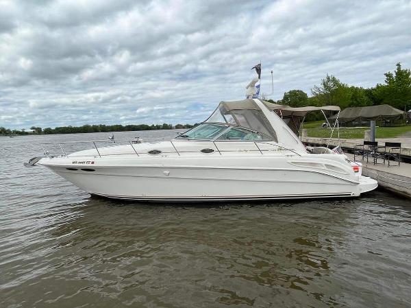 Sea Ray 340 Sundancer 2000 Sea Ray 340 Sundancer docked on a calm lake under cloudy skies.