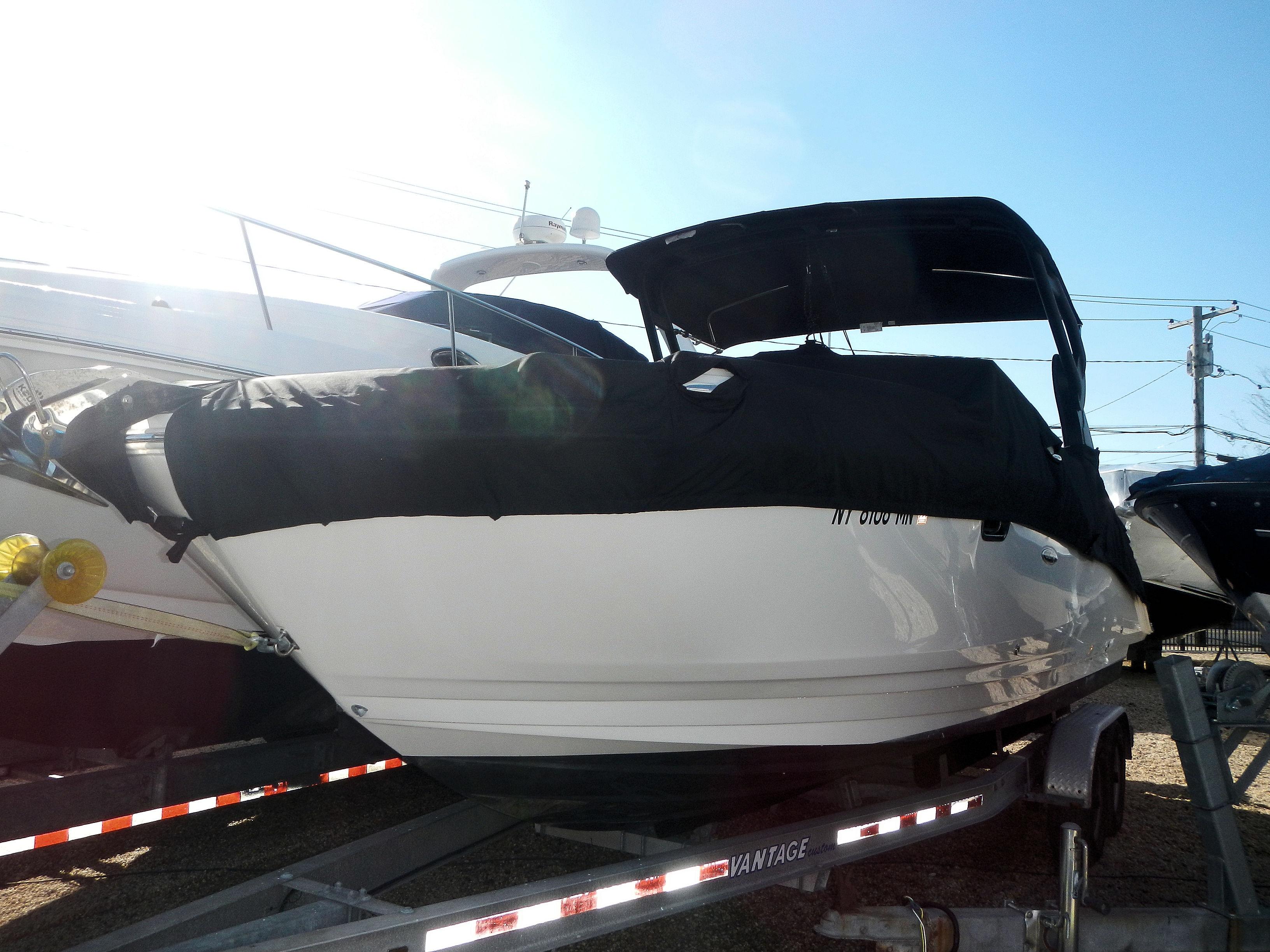 Sea Ray 270 SDX 2019 Sea Ray 270 SDX boat on trailer, covered and ready for transport.