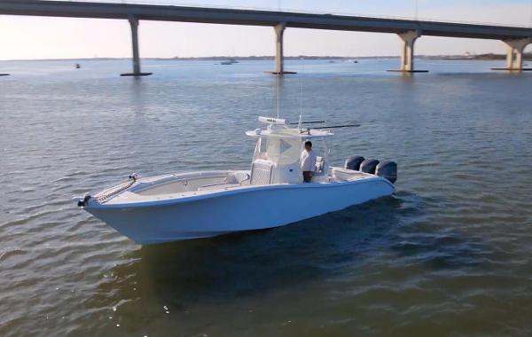 Yellowfin 34 Offshore 2017 Yellowfin 34 Offshore boat cruising under a bridge on calm waters.